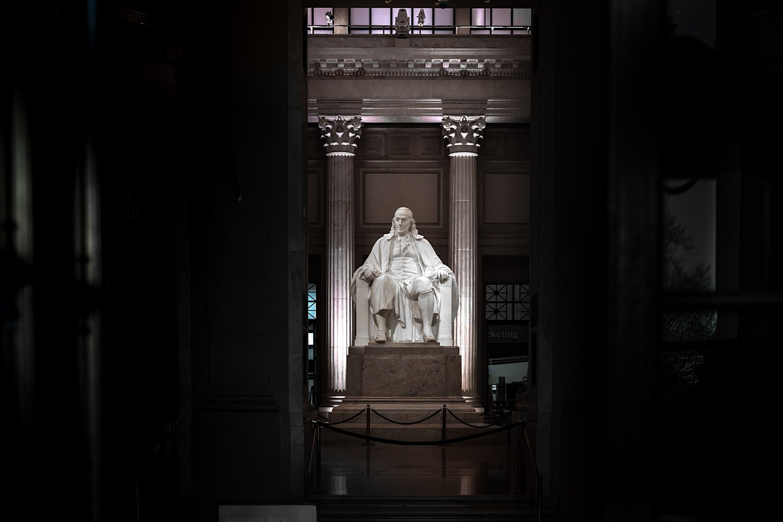white concrete statue on brown wooden table von: Dan Mall on Unsplash
